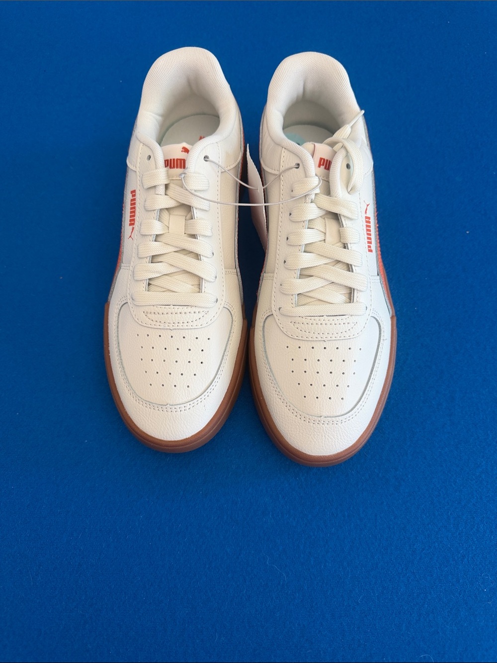 Puma Men’s White Sneakers with Gum Outsole and Orange Accents